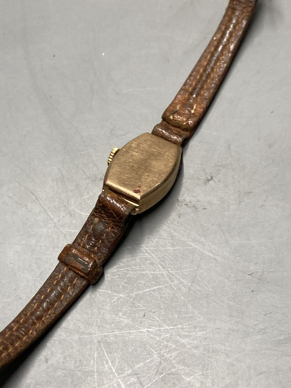 A 9ct gold vintage wristwatch with circular dial and subsidiary seconds dial (converted) and three other 9ct gold watches,